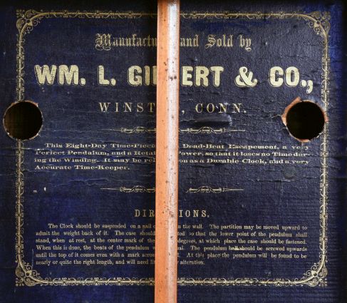 William L. Gilbert & Co., Winsted, Conn., "Round Long Drop Calendar" regulator designed by S. B. Terry while working for Gilbert, 1859-1861. 8 days, weight driven brass timepiece with Galusha Maranville patent calendar, c1862