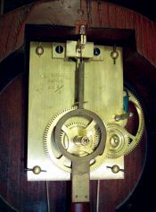 Lyre wall clock, weight driven, Massachusetts, gilt front mahogany case, leaf and scroll carved throat panel and lower door with paint decorated tablets, bottom with gilt bracket and acorn drop, Roman numeral painted metal dial, 8 days timepiece movement with front plate signed "E. Howard & Co., Boston 28 1/2", with Howard pendulum, 20th century.