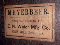 E.N. Welch Mfg. Co., Forestville, Conn., "Meyerbeer", wall clock, 8 days, time and strike, on cathedral gong, spring driven movement in a walnut case with papered metal dial and silk screened glass, c1892