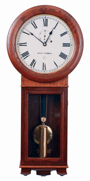 Seth Thomas Clock Co., Thomaston, Conn., "Regulator No. 2" reproduction in an oak case with a weight driven timepiece movement, c1978.