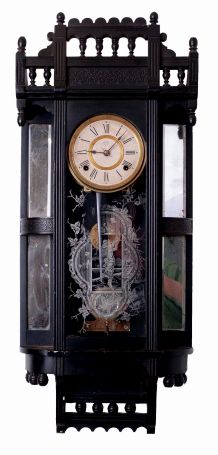 Ansonia Clock Co., New York, NY "Reflector" wall clock in an ebony finished case with a spring driven, 8 days, time & strike movement, c1886.
