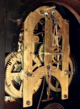Ansonia Clock Co., New York, NY "Reflector" wall clock in an ebony finished case with a spring driven, 8 days, time & strike movement, c1886.