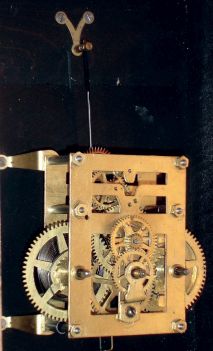 New Haven Clock Co., New Haven, Conn., "14" Gallery", wall clock, 30 days, time only, spring driven movement in a hardwood case with walnut finish with a papered metal dial, c1910.