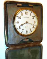 France, for Bigelow, Kennard, & Co., Boston, Mass., hour repeating carriage clock with alarm, gilt Corniche case with bevelled glasses, Roman numeral white enamel dial with with Arabic chapter alarm, blued steel Breguet style hands, 8 days, time, strike and alarm movement with lever platform, repeating the last hour on demand, c1890 and a Waltham 8 days car clock in leather travel case