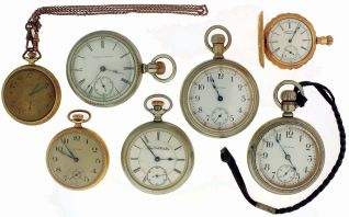 Pocket watches- 7 (Seven): 18 size, 15 jewel Illinois "Miller", nickel open face case, 6 size, 11 jewel Waltham, gold filled open face case, 16 size, 7 jewel Waltham, gold filled open face case, 12 size, 7 jewel Elgin, gold filled open face case, 18 size, 15 jewel Elgin, nickel open face case, 18 size, 15 jewel Elgin, nickel open face case, and an 18 size 15 jewel Waltham, open face nickel case with inlaid gold stag