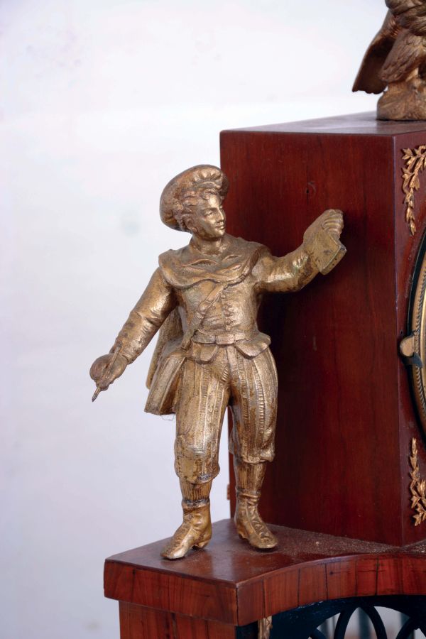 Austria, shelf or mantel clock, fruitwood case, base with arcaded portico with mirrored back, and alabaster columns supporting the square clock case, flanked by male and female figures and with eagle finial, Arabic numeral white enamel dial, 2 day grand sonnerie striking brass movement with date display, c1820