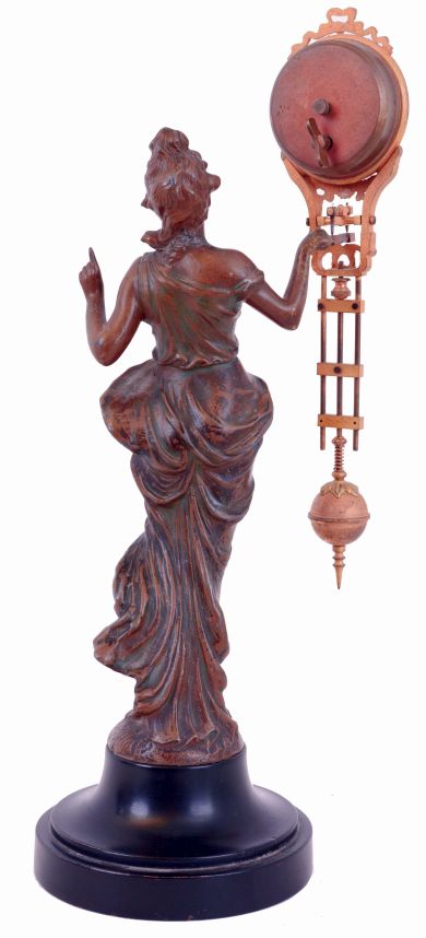 Junghans "Diana" swinger, patinated spelter figure standing on a turned, ebonized base and holding the clock with her right hand, gilt clock/ pendulum with Arabic numeral Canadian white enamel dial, 8 days timepiece movement, c1930