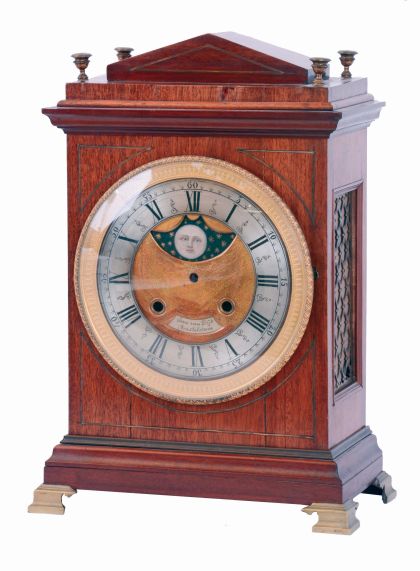 European bracket clock, mahogany and mahogany veneer oak case in the Regency style, gilt brass bracket feet, brass stringing and molding, engine turned gilt bezel with Roman numeral silvered dial, the matted, gilt center with silvered plaque signed "Jan Van Dijk Amsterdam", and also with painted moon phase disc, 15 day rectangular brass, time and strike movement with verge escapement, five turned baluster pillars, pierced steel warning and locking levers, movement early 18th century, case early 19th century