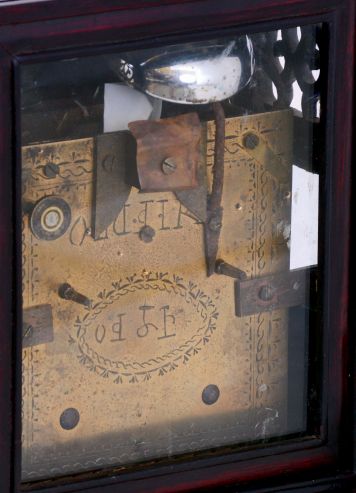 China, bracket clock, camphor wood case with glazed panels, resting on a pierced and carved base, Roman numeral white enamel dial mounted to a brass plate, brass time and strike fusee movement with verge escapement, and engraved back plate