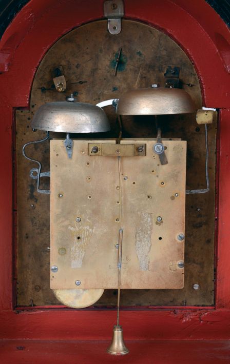 Austria, bracket clock, ebonized case with molded break arch top, molded base, cast brass feet and carrying handle, sheet brass dial with mock pendulum, gilt spandrels, Roman numeral white enamel dial, the arch with controls for the striking, and with landscape painting on enamel, pierced and engraved brass hands, case with glazed sides, and Helios mask frets, three train, quarter striking movement with verge escapement, strike trains with going barrels, time train with fusee, c1800