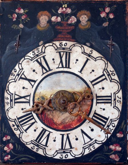 Frisian stoelklok, polychrome painted shelf with mermaids and painted floral decoration, lead ornaments with gilding and with painted swan, Roman numeral painted, arcaded dial with a disturbing pair of reclining figures, urn with flowers, and central vignette with landscape and a building, pierced brass hands, typical baluster turned brass four pillar, time and strike movement with alarm, bell hammer arbor of brass and with matching baluster turnings, large brass pear shaped weight, late 18th- early 19th century