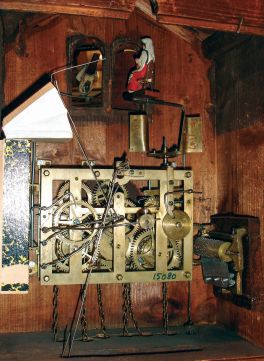 German, for Swiss Clock Company, New York, large carved walnut 3-weight wall clock with music box and seated lady in second door, c1890