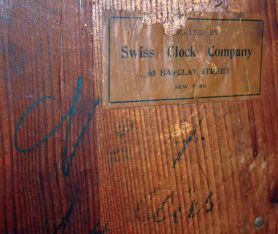 German, for Swiss Clock Company, New York, large carved walnut 3-weight wall clock with music box and seated lady in second door, c1890
