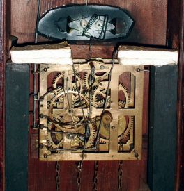 Eastern European or German, architectural cuckoo, a painting of a gypsy with the clock in her belly, and her eyes moving from side to side as the clock runs, c1900