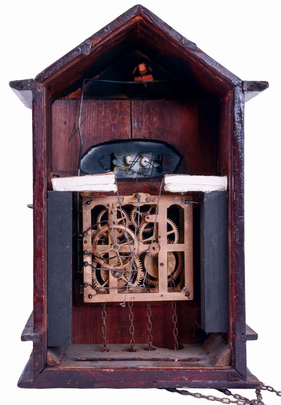Eastern European or German, architectural cuckoo, a painting of a gypsy with the clock in her belly, and her eyes moving from side to side as the clock runs, c1900