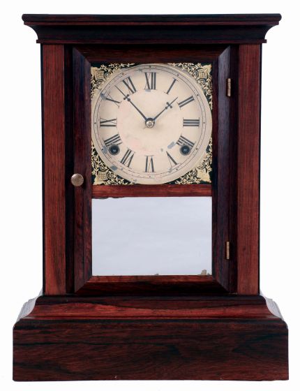 Atkins Clock Co., Bristol, Conn. Cottage mantel clock in a rosewood veneered case with a spring driven, 8 days, time and strike movement, c1870.