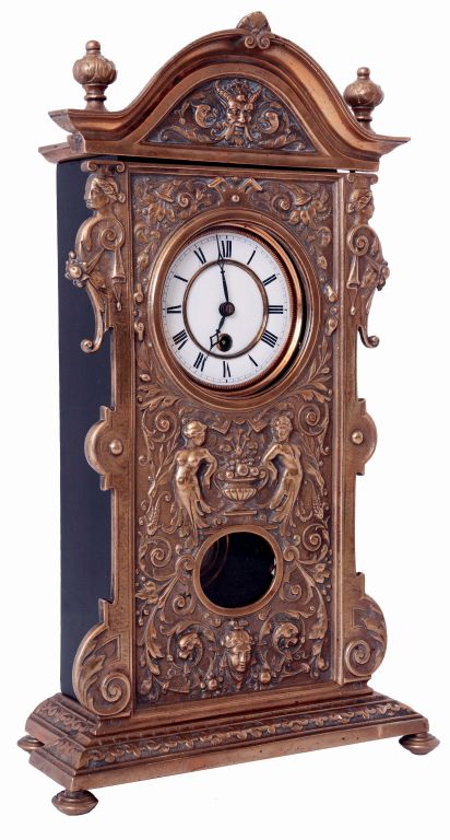 Gustav Becker, Germany, desk or table clock, the cast brass front ornamented in the Adamesque style, also with half caryatids, and arched top with satyr mask, the back of the top marked "Sim. K. Noch 13888", all mounted to an ebonized wooden case, with Roman numeral white enamel dial, black steel hands, 8 days timepiece movement, the back plate with Becker logo, R/A pendulum suspended from the top of the movement mounting bracket, c1890