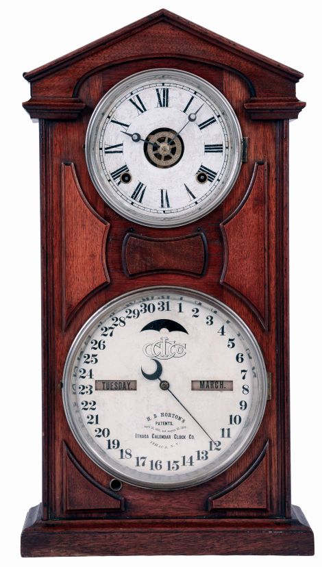 Ithaca Calendar Clock Company, Ithaca, NY., "No. 7 Shelf Cottage" mantel clock in a walnut case with a spring driven, 8 days, time, strike and alarm movement (by Noah Pomeroy. Bristol, Conn.) with Horton