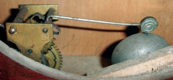 Ithaca Calendar Clock Company, Ithaca, NY., "No. 7 Shelf Cottage" mantel clock in a walnut case with a spring driven, 8 days, time, strike and alarm movement (by Noah Pomeroy. Bristol, Conn.) with Horton