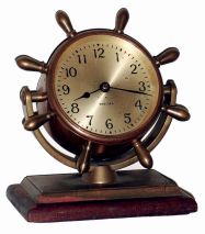 Chelsea Clock Co., Boston, Mass., "Comet", bronze on mahogany base, 8 days, time only swivel head yacht wheel desk clock, c1948