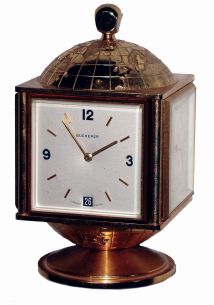 Bucherer, Swiss, 8 days, 15 jewel globe-top brass and beveled glass clock with calendar and weather station, rotating base, c1970