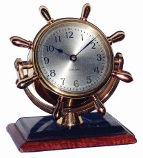 Chelsea Clock Co., Boston, Mass., "Comet", brass on mahogany base, 8 days, time only swivel head yacht wheel desk clock, c1948