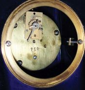 Unsigned, French, 8 days time only movement in porcelain miniature long case clock with later balance platform, c1910