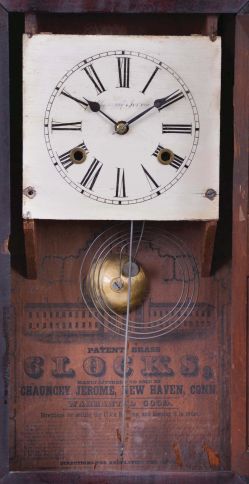 Chauncey Jerome, New Haven, Conn., Empire case shelf clock with a weight driven 30 hour time and strike movement in a mahogany veneered case.