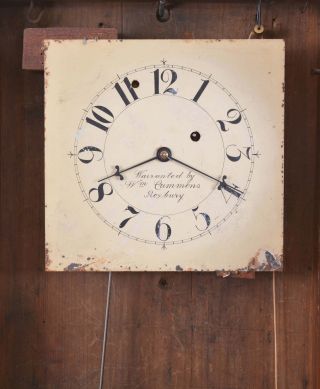 New Hampshire style mirror wall clock with 8 day, time only, weight driven, brass movement in a mahogany case with reverse painted tablet and mirror.