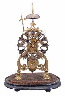 England, late 19th Century, passing strike skeleton clock, in a fretted brass scroll frame, no dome.