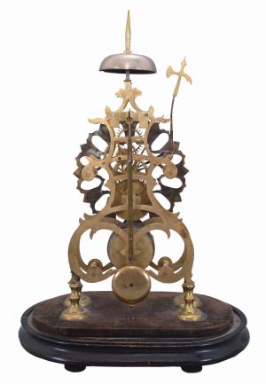 England, late 19th Century, passing strike skeleton clock, in a fretted brass scroll frame, no dome.