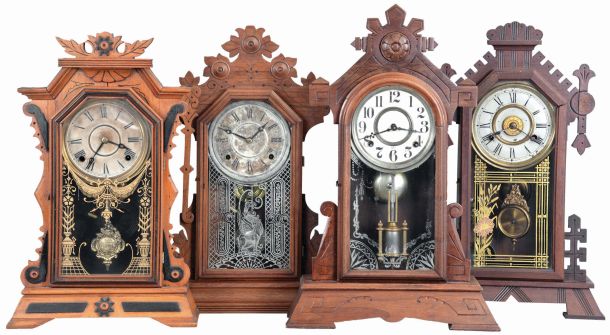 Clocks- 4 (Four): (1) E. Ingraham & Co., Bristol, Conn., "Faultless" shelf clock with a spring driven, 8 day, time and strike movement in a light wood case with black ornaments, c1884; (2) New Haven Clock Co., New Haven, Conn., "Euphrates" shelf clock with a spring driven, 8 day time, strike and alarm movement in a black walnut case, c1885. (3) E. Ingraham Clock Co., unidentified shelf clock with a spring driven, 8 day, time and strike movement in a walnut case, c1885. (4) Gilbert Clock Co., Winsted, Conn., "Nereid" shelf clock with a spring driven, 8 day, time and strike movement in a walnut case, c1881.