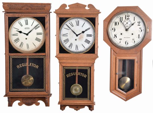 Clocks- 4 (Four): (1) E. Ingraham Co., Bristol, Conn., "Western Union" hanging clock with a spring driven, 8 day timepiece movement in a solid oak case, c1905; (2) E. Ingraham Co., Bristol, Conn., "Reliance" hanging clock with a spring driven, 8 day timepiece movement in a solid oak case, c1911; (3) Seth Thomas Clock Co., Thomaston, Conn., "World" hanging clock with a spring driven double wind 30 day timepiece movement in an oak case, c1921; (4) Bench made wall clock with E. Howard & Co., NO. 5, 8 day, weight driven, time only nickel plated movement and Howard damascened pendulum bob with painted metal dial.