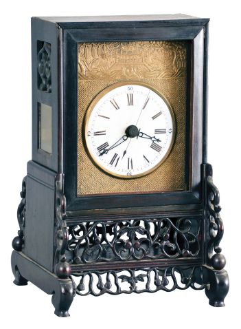 China, bracket clock reproduction, 8 day, time and strike, double fusee, crown verge with center seconds in a rosewood case on fretwork base, white porcelain dial on patterned brass front plate, 20th century.