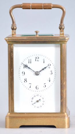 France, striking carriage clock with hour repeat, Corniche case with beveled glass panels, Arabic numeral white enamel dial, blued steel distaff hands, 8 day time, strike and alarm movement with lever platform and cut bimetallic balance, repeating the last hour on demand, with partial travel case