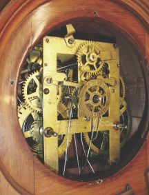 Ithaca Calendar Clock Co., Ithaca, New York, "No. 8 Shelf Library" double dial calendar clock with a spring driven, 8 day time, strike and alarm movement in a walnut case.