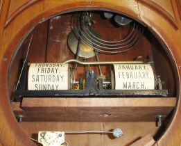 Ithaca Calendar Clock Co., Ithaca, New York, "No. 8 Shelf Library" double dial calendar clock with a spring driven, 8 day time, strike and alarm movement in a walnut case.