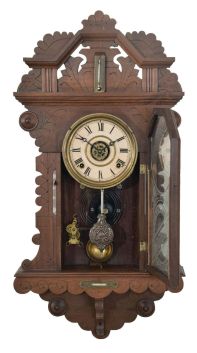 E. Ingraham & Co., Bristol, Conn., "? Drop", 8 day, time, strike and alarm spring brass movement wall clock. This premium model clock looks to be a variation on the "Amulet" mantel clock. There is a partial label that states this clock is manufactured exclusively for a company, but the name is difficult to read.
