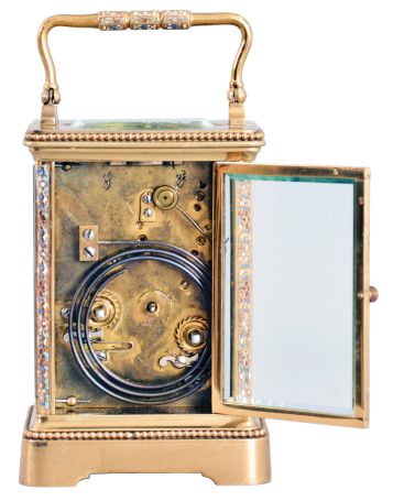 France, for Frank Herschede, Cincinnati, an 8 day, two train carriage clock with champleve enamel ormnament, polished brass Corniche case with enamel accented corners and handle, Arabic numeral white enamel dial with floral featoons, blued steel Breguet style hands, 8 day, time and strike movement with lever platform, counting the hours on a gong