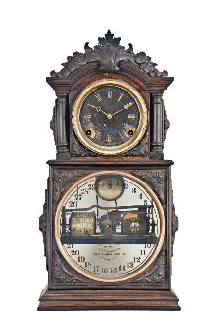Ithaca Clock Co., Ithaca, New York, "3 1/2 Parlor" Calendar Clock with black and silvered roman numeral dial, tri-foil hands, lower clear glass reveals the glass calendar dial marked "H. B. Horton