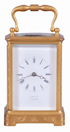France, for Hall & Co., Manchester, an engraved carriage timepiece for the English market, the glazed, gilt Corniche case with foliate ornament, Roman numeral white enamel dial, blued steel Breguet style hands, 8 day movement with lever platform, the back plate marked "B" within a circle