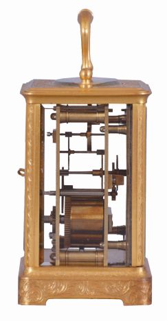 France, for Hall & Co., Manchester, an engraved carriage timepiece for the English market, the glazed, gilt Corniche case with foliate ornament, Roman numeral white enamel dial, blued steel Breguet style hands, 8 day movement with lever platform, the back plate marked "B" within a circle