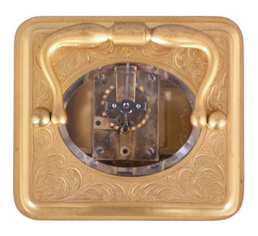 France, for Hall & Co., Manchester, an engraved carriage timepiece for the English market, the glazed, gilt Corniche case with foliate ornament, Roman numeral white enamel dial, blued steel Breguet style hands, 8 day movement with lever platform, the back plate marked "B" within a circle