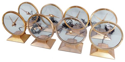 Clocks- 8 (Eight) Jefferson Electric Company, Bellwood, Illinois, "Golden Hour" electric mystery clock with hands suspended in clear glass dial in gold plated cases with classic mid-century modern design.