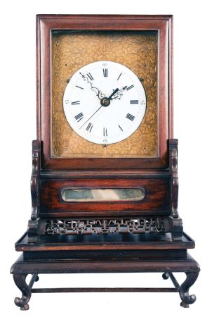 China, bracket clock reproduction, 8 day, time and strike, double fusee with crown verge escapement center seconds in a rosewood case sitting on fretwork base, white enamel dial mounted on cast brass front plate, 20th century.
