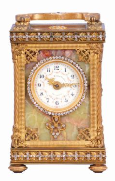 France, for Bailey, Banks & Biddle Co., Philadelphia, a very decorative striking carriage clock with original travel case, the gilt case with green onyx panels, top and base with gilt fret, the frets, handle and bezel set with brilliants, Arabic numeral white enamel dial with polychrome enamel floral garlands, gilt Louis XV style hands, 8 day, time and strike movement with lever platform counting the hours in passing, together with its original leather covered travel case and key