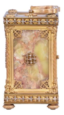 France, for Bailey, Banks & Biddle Co., Philadelphia, a very decorative striking carriage clock with original travel case, the gilt case with green onyx panels, top and base with gilt fret, the frets, handle and bezel set with brilliants, Arabic numeral white enamel dial with polychrome enamel floral garlands, gilt Louis XV style hands, 8 day, time and strike movement with lever platform counting the hours in passing, together with its original leather covered travel case and key
