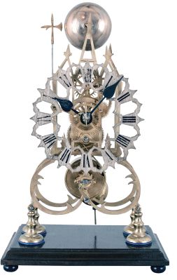 England, 3 spire Gothic frame, single fusee skeleton clock, with a silvered fretted dial, passing strike [single bell on the hour], no dome, mounted to a rectangular wooden base.