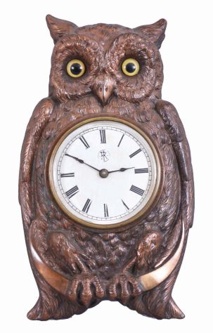 F. Kroeber Clock Co., New York, "Brass Owl ", 30 hour, time and alarm, spring driven brass movement in a brass casting of an owl with glass eyes.