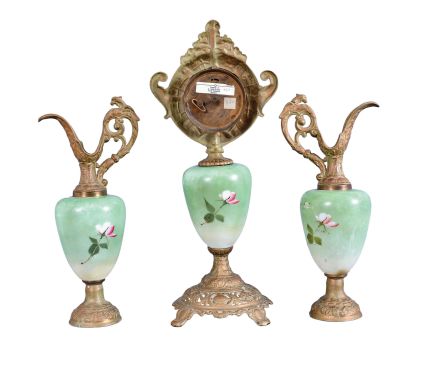 F. Kroeber Clock Co., New York, "China K457" 3 piece mantel garniture, clock and matching ewers, 30 hour, time only, spring driven lever escapement mounted on green porcelain with floral motif supported and topped by cast spelter parts with finish simulating old bronze with verdigris.